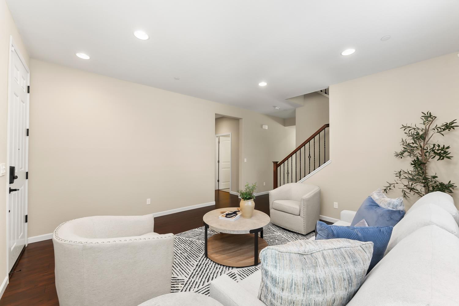 5453 Mossy Stone Way Rancho Cordova, CA 95742 - Photo 11 of 81 a living room with furniture and white walls