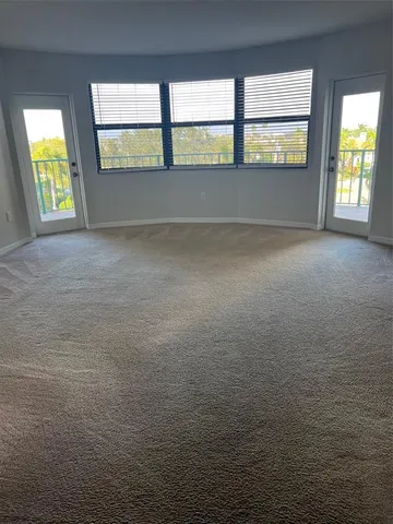 a kitchen with a sink cabinets and stainless steel appliances