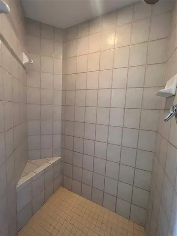 a kitchen with stainless steel appliances granite countertop a sink refrigerator and cabinets