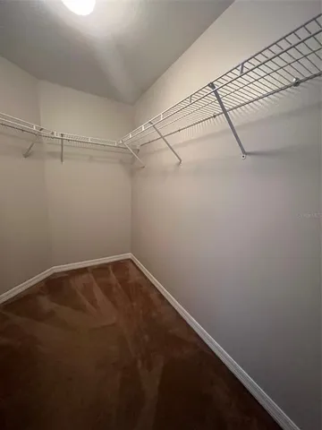 a view of a living room and kitchen with a sink