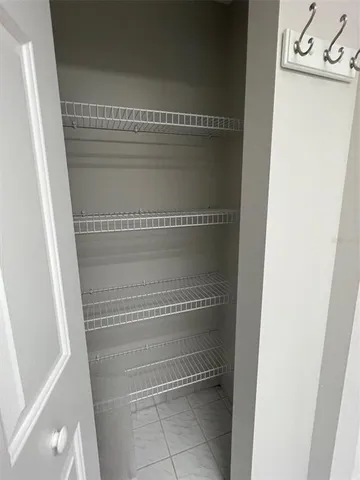 a kitchen with a table and chairs in it