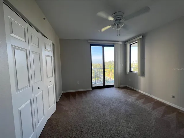 a view of a balcony with dining table