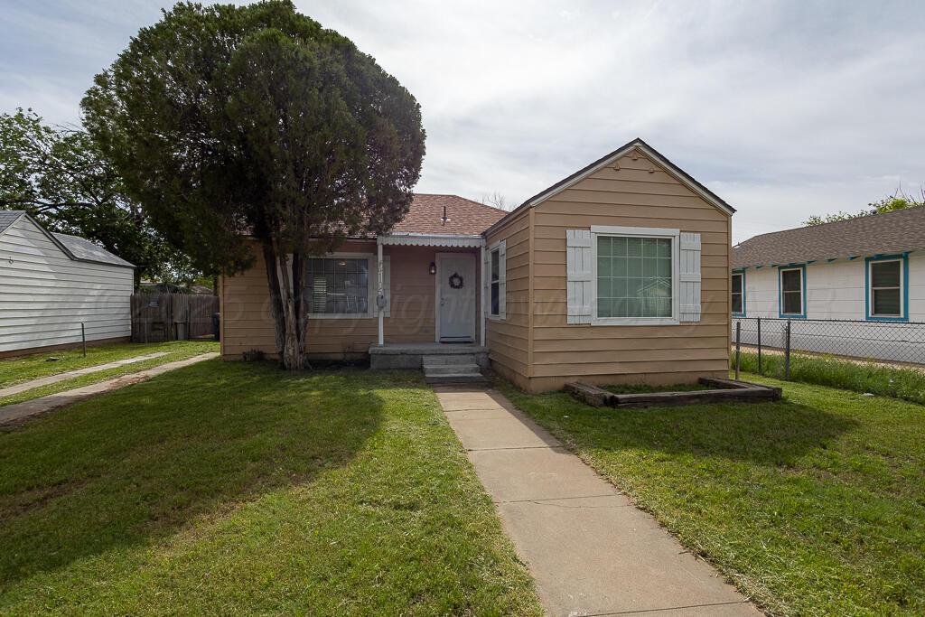 4105 Gables Street Amarillo, TX 79110 - Photo 1 of 18 a view of a house with a yard