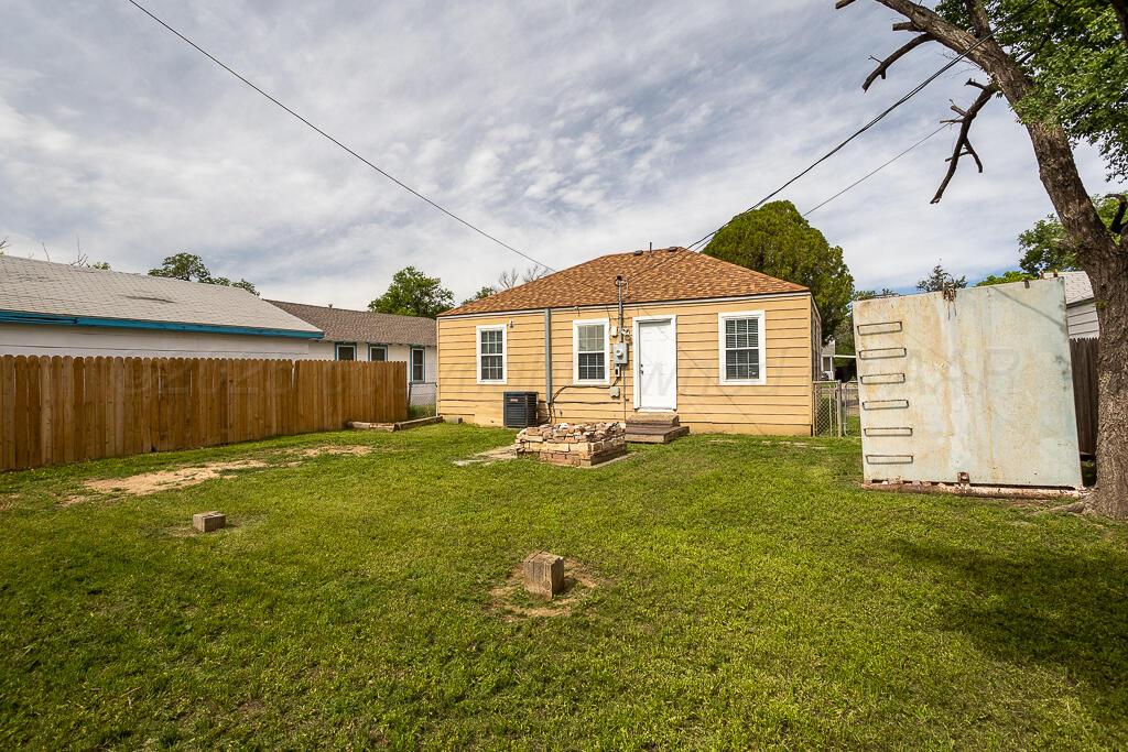 4105 Gables Street Amarillo, TX 79110 - Photo 16 of 18 a backyard of a house with lots of green space