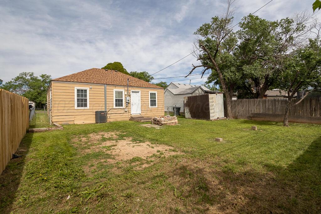 4105 Gables Street Amarillo, TX 79110 - Photo 17 of 18 a front view of a house with a yard