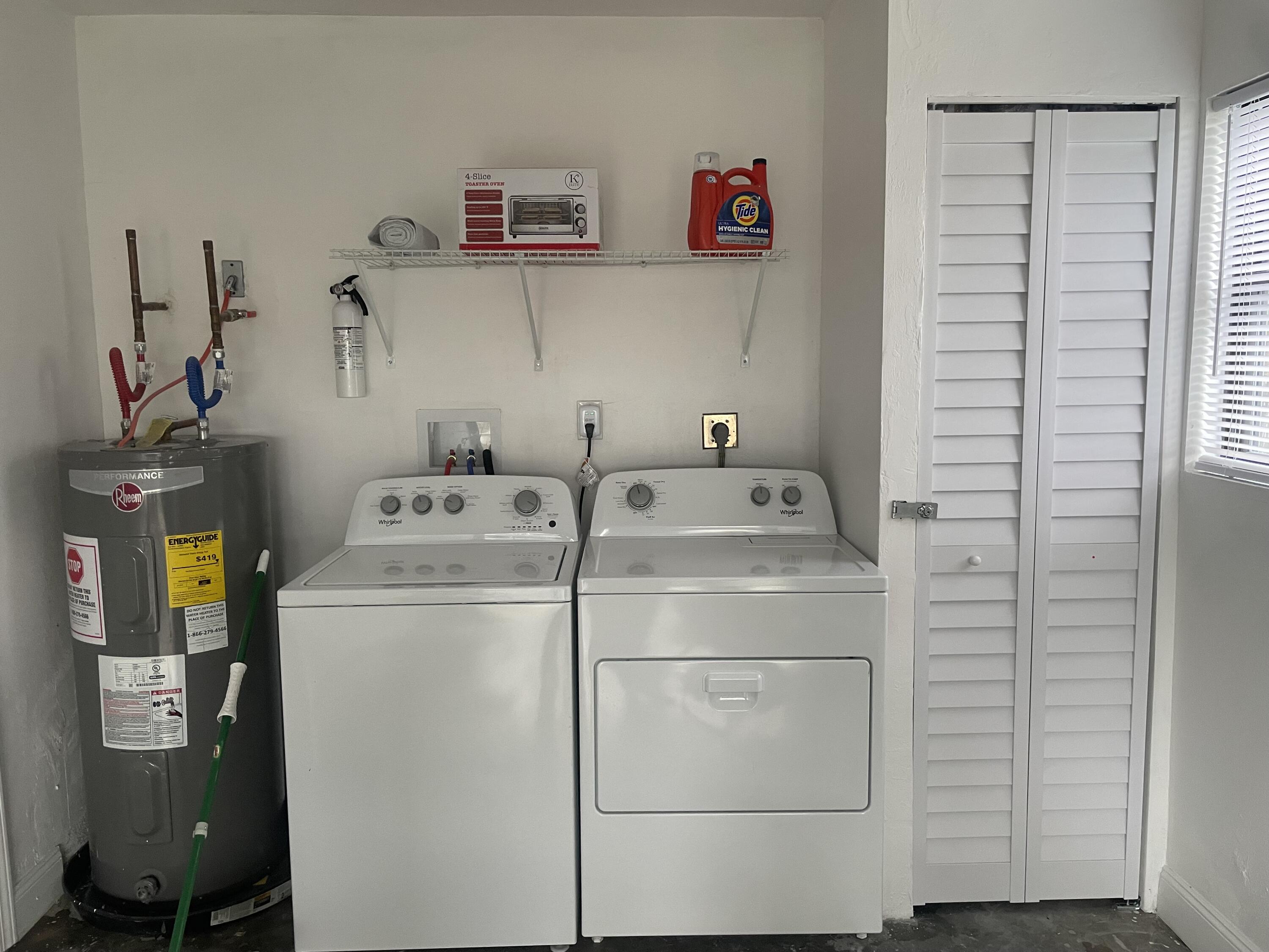 983 Emerald Road Southeast Palm Bay, FL 32909 - Photo 31 of 33 CLOSET INSIDE GARAGE