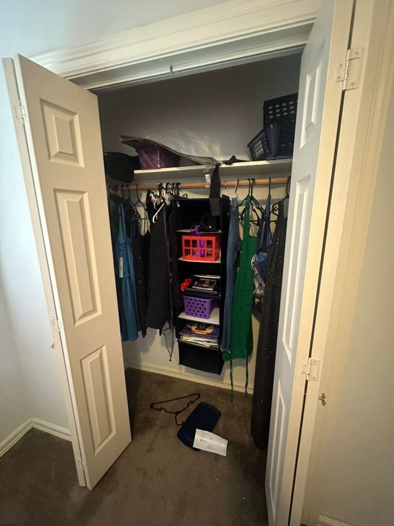 8404 Leander Street Houston, TX 77012 - Photo 20 of 28 a view of walk in closet with clothes