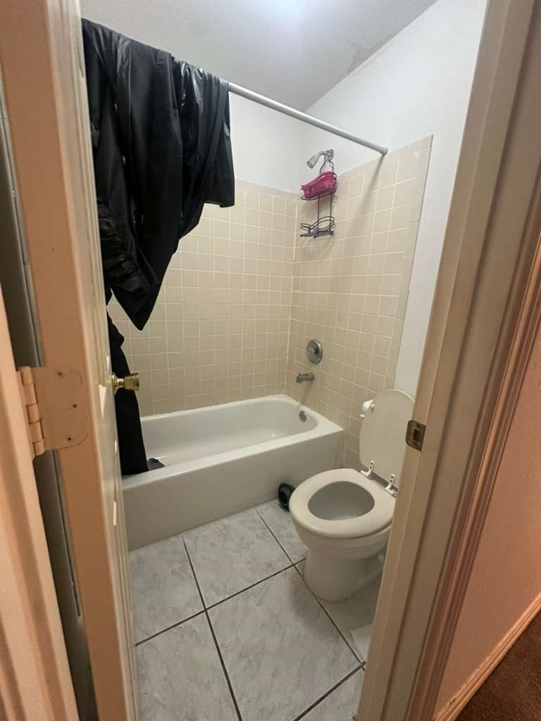 8404 Leander Street Houston, TX 77012 - Photo 23 of 28 a bathroom with a sink and a vanity