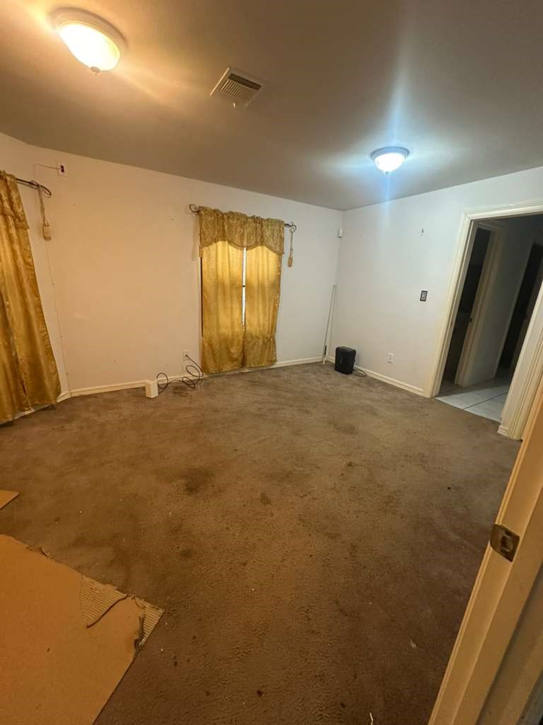 8404 Leander Street Houston, TX 77012 - Photo 7 of 28 a view of an empty room with a window