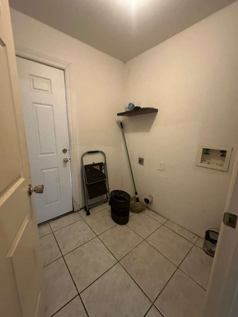 8404 Leander Street Houston, TX 77012 - Photo 10 of 28 a bathroom with a sink and a shower