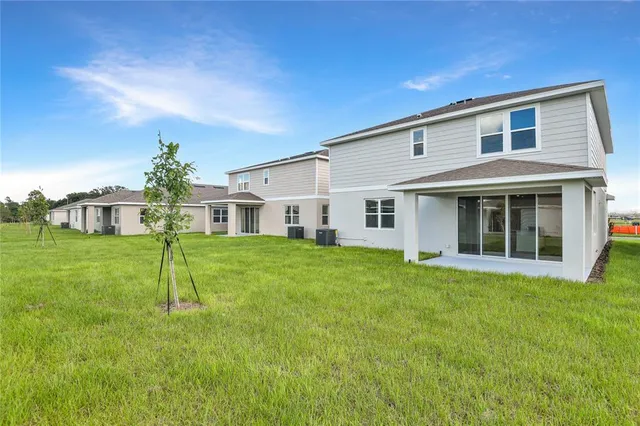 a view of a yard in front of a house