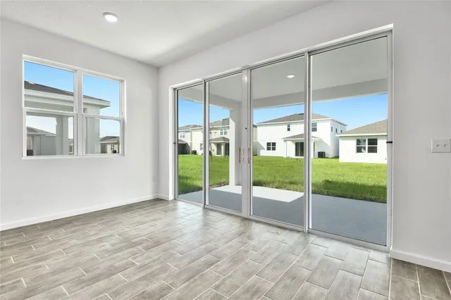 a view of an empty room with glass door