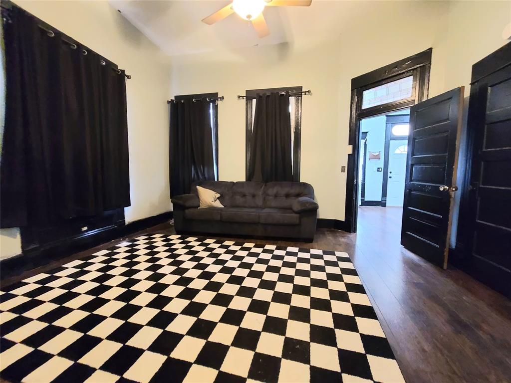 615 West Gandy Street Denison, TX 75020 - Photo 15 of 20 Living area featuring a ceiling fan and baseboards