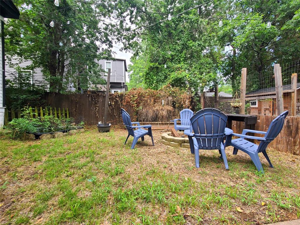 615 West Gandy Street Denison, TX 75020 - Photo 20 of 20 View of yard with a fire pit