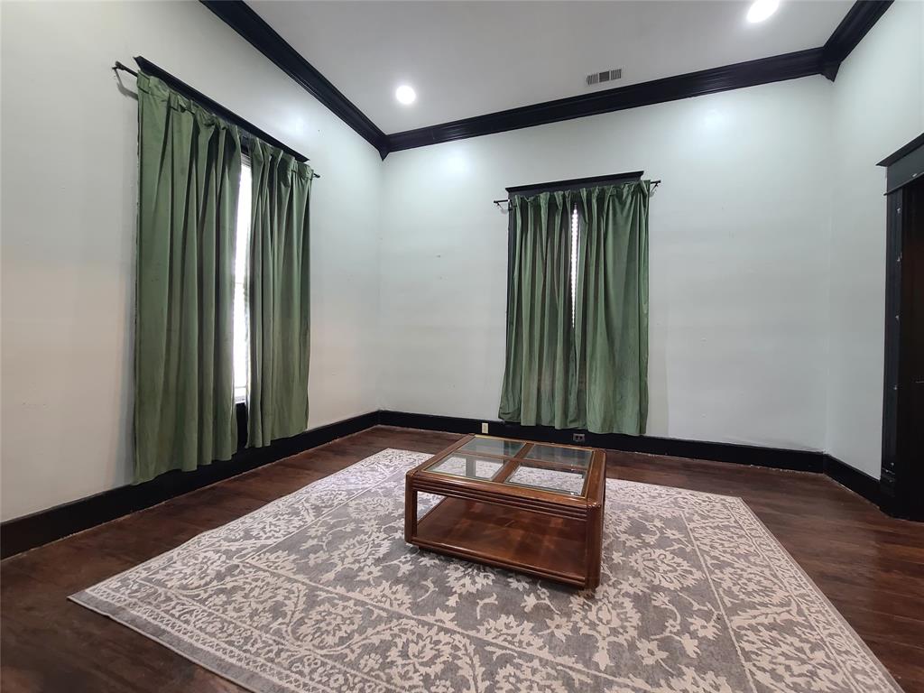 615 West Gandy Street Denison, TX 75020 - Photo 4 of 20 Living room featuring ornamental molding and wood finished floors