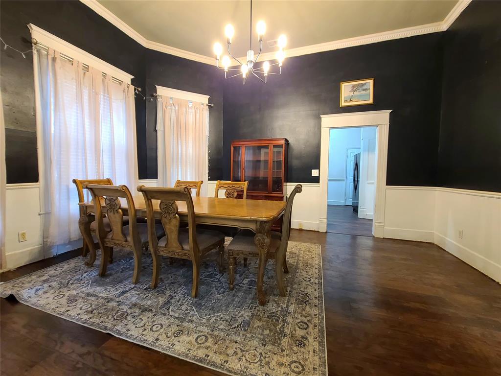 615 West Gandy Street Denison, TX 75020 - Photo 9 of 20 Dining room with a chandelier, crown molding, and wood finished floors