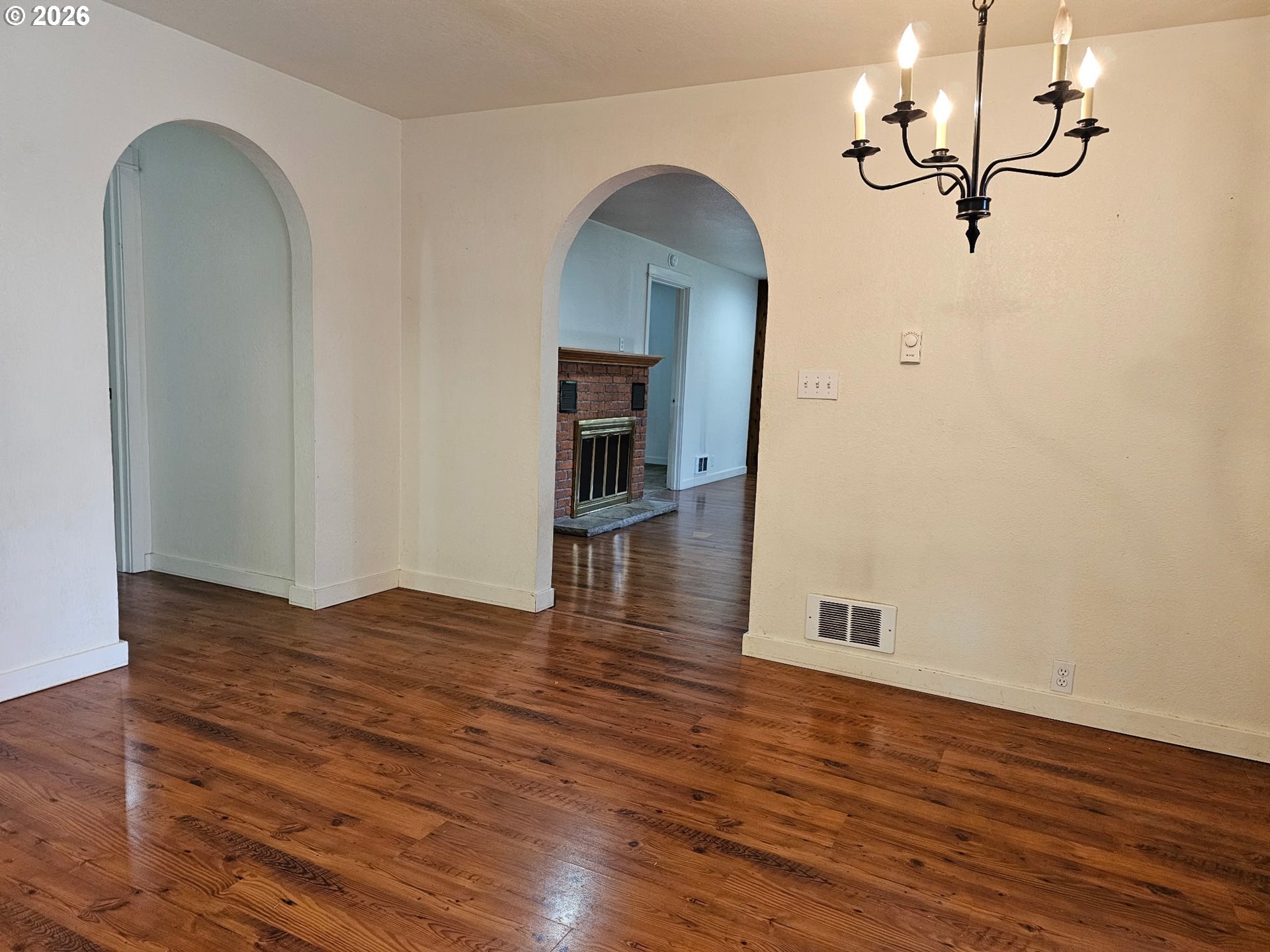 33802 Market Road Creswell, OR 97426 - Photo 8 of 30 a view of empty room with wooden floor and ceiling fan