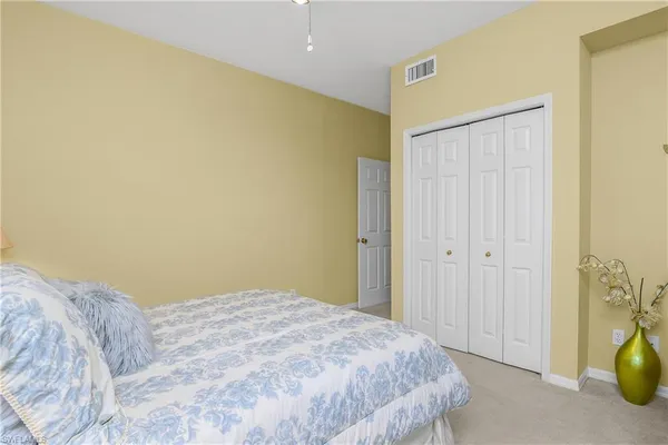 a bedroom with a bed and a shower