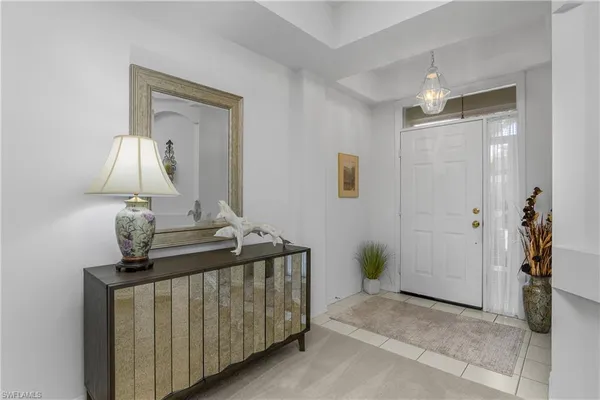 a bedroom with a bed and a mirror