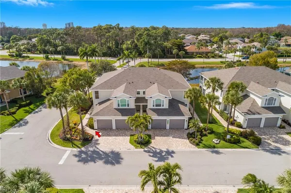 an aerial view of a house with a lake view