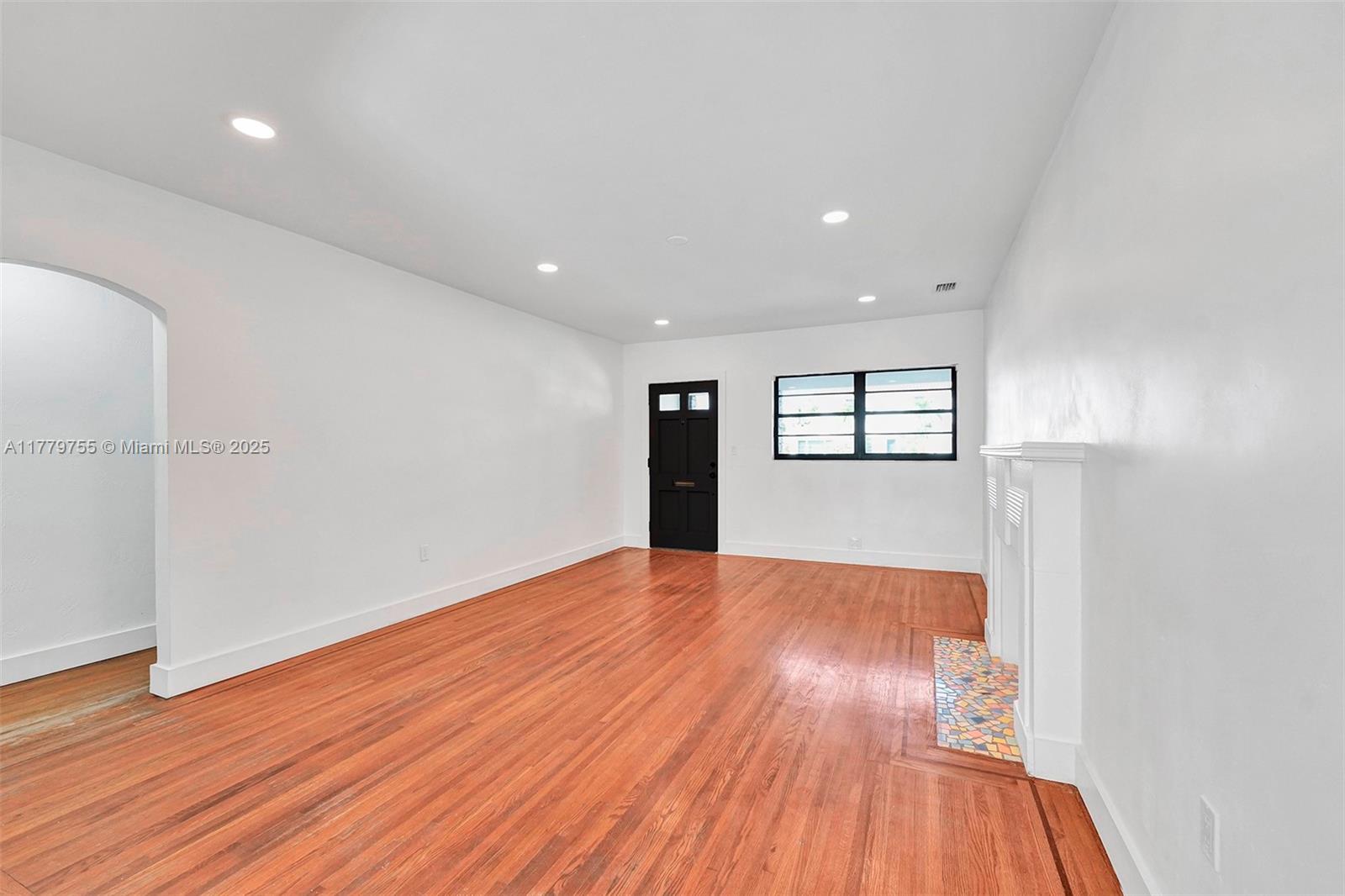 9173 Byron Avenue Surfside, FL 33154 - Photo 12 of 25 a view of empty room with wooden floor