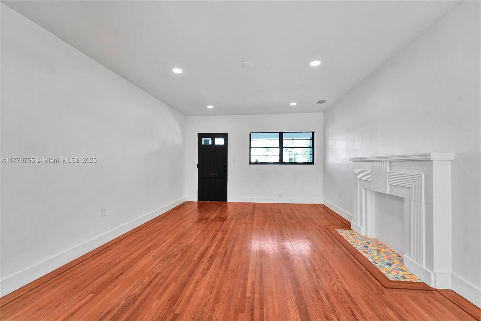 9173 Byron Avenue Surfside, FL 33154 - Photo 14 of 25 a view of an empty room and window
