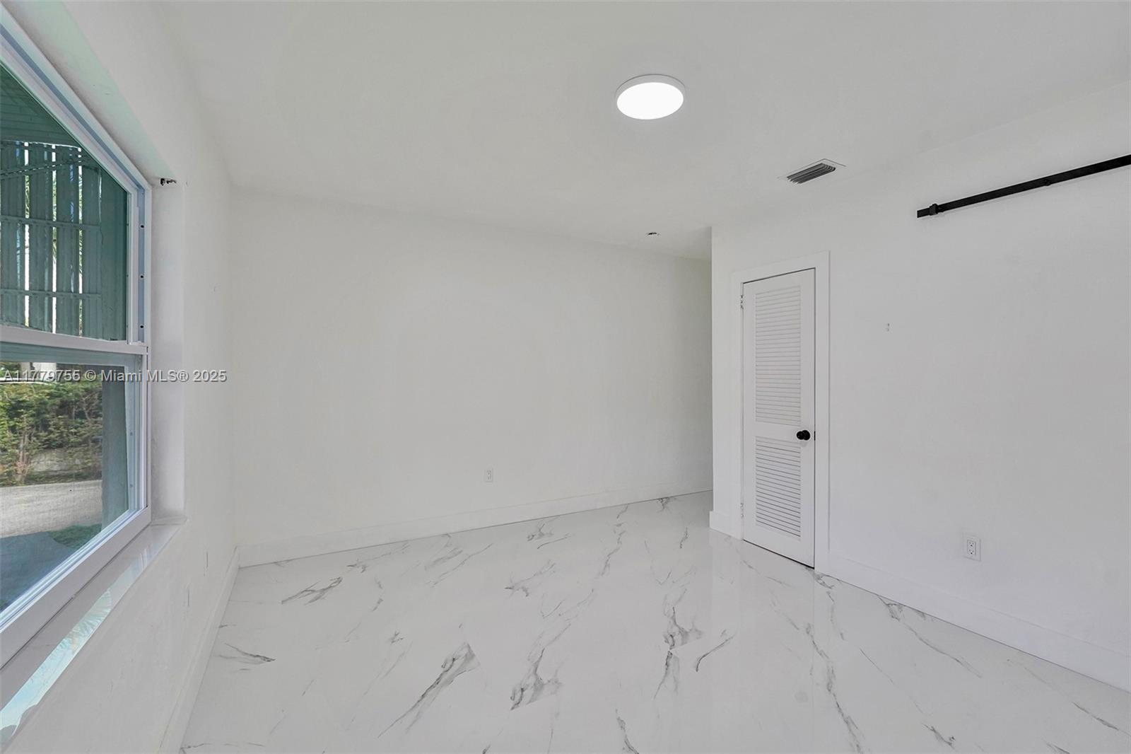 9173 Byron Avenue Surfside, FL 33154 - Photo 4 of 25 a view of an empty room