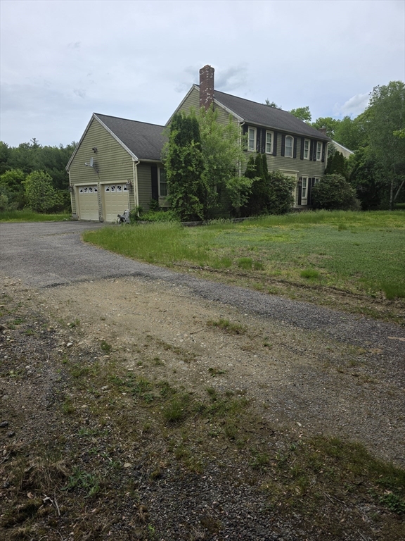 4 Canoe River Road Easton, MA 02375 - Photo 6 of 9 a front view of a house with garden
