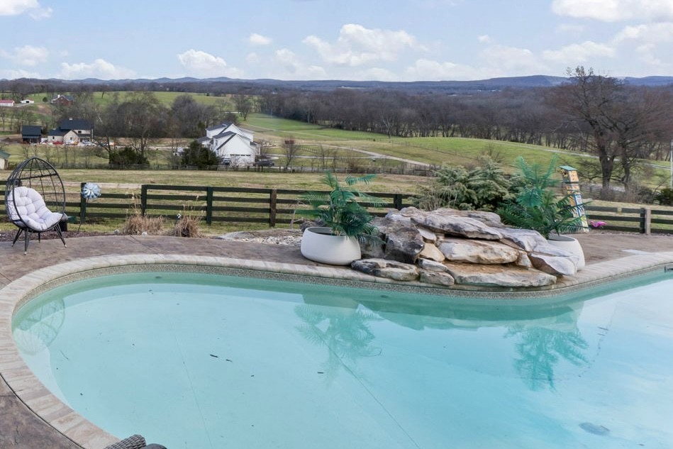 1180 Allisona Road Eagleville, TN 37060 - Photo 16 of 65 a view of a swimming pool with a yard and plants