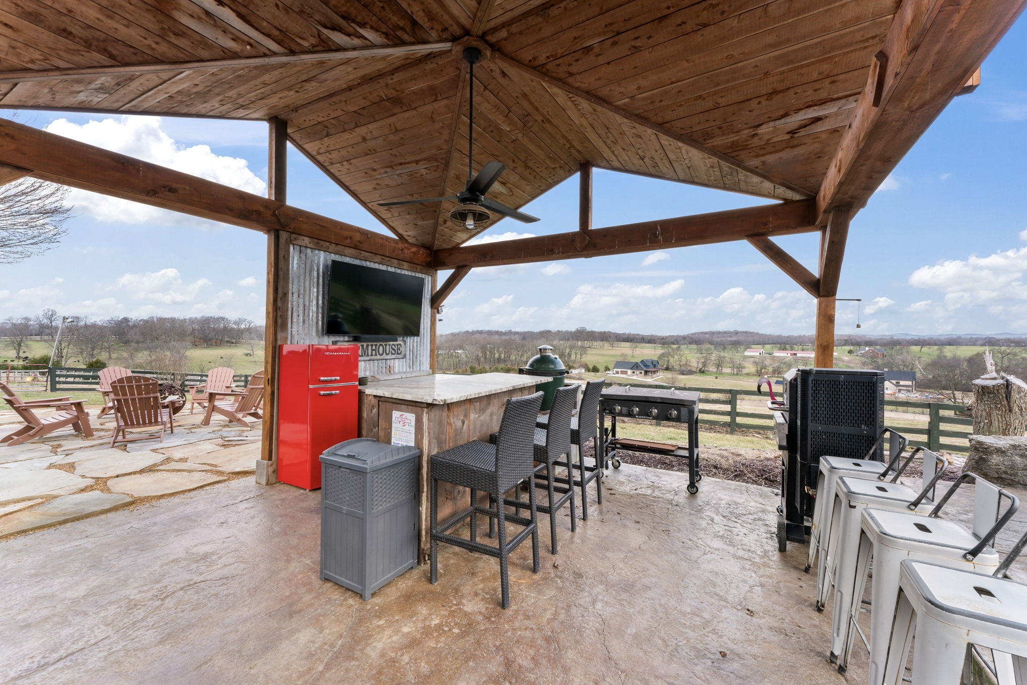 1180 Allisona Road Eagleville, TN 37060 - Photo 18 of 65 a view of a tables and chairs under an umbrella