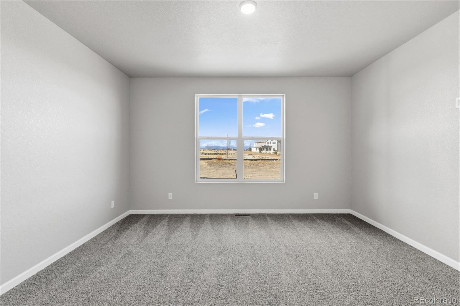 6801 Utica Court Firestone, CO 80504 - Photo 11 of 22 an empty room with a window
