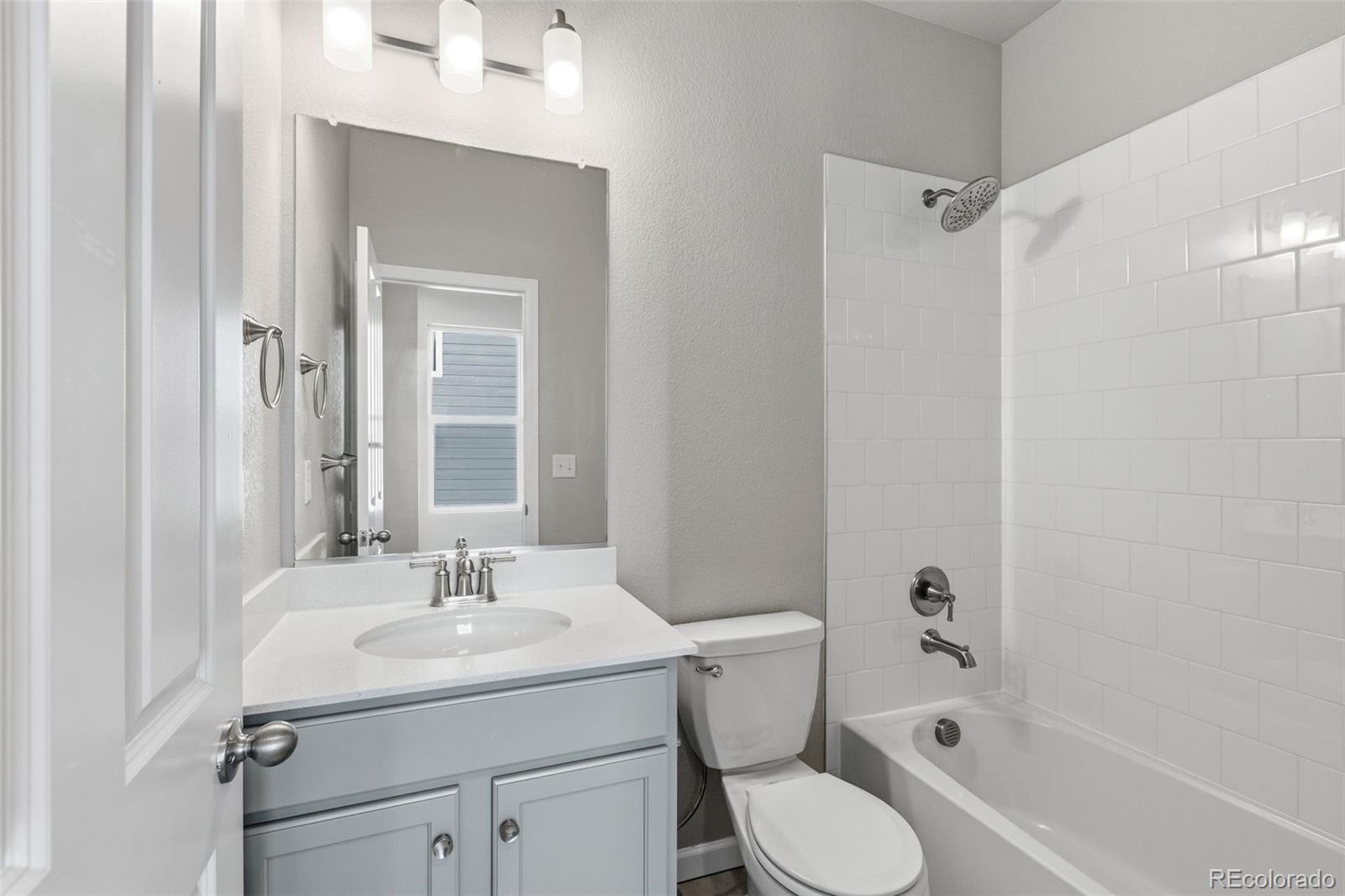 6801 Utica Court Firestone, CO 80504 - Photo 17 of 22 a bathroom with a sink toilet and shower