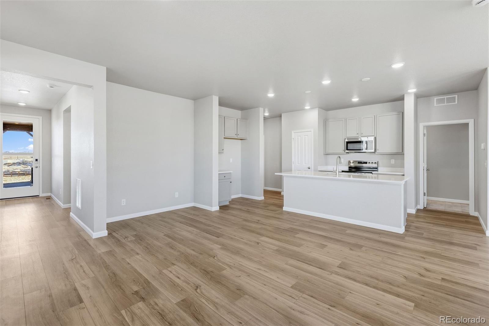 6801 Utica Court Firestone, CO 80504 - Photo 2 of 22 a view of a kitchen with a sink and a refrigerator