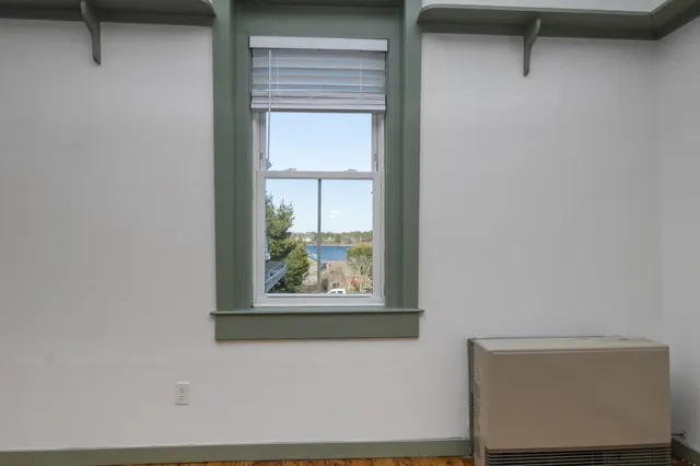a view of wooden floor and cabinet