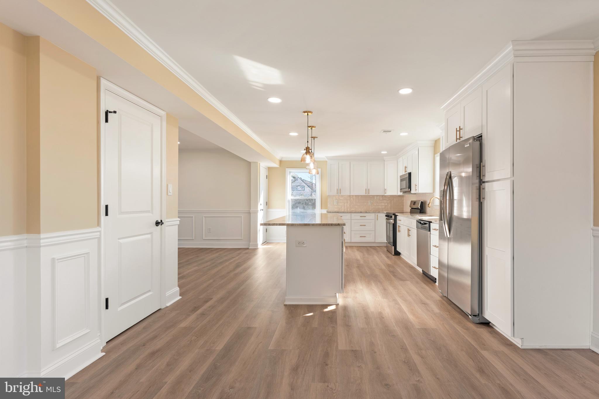 43 Petunia Road Levittown, PA 19056 - Photo 13 of 35 a view of kitchen dining table chairs and refrigerator