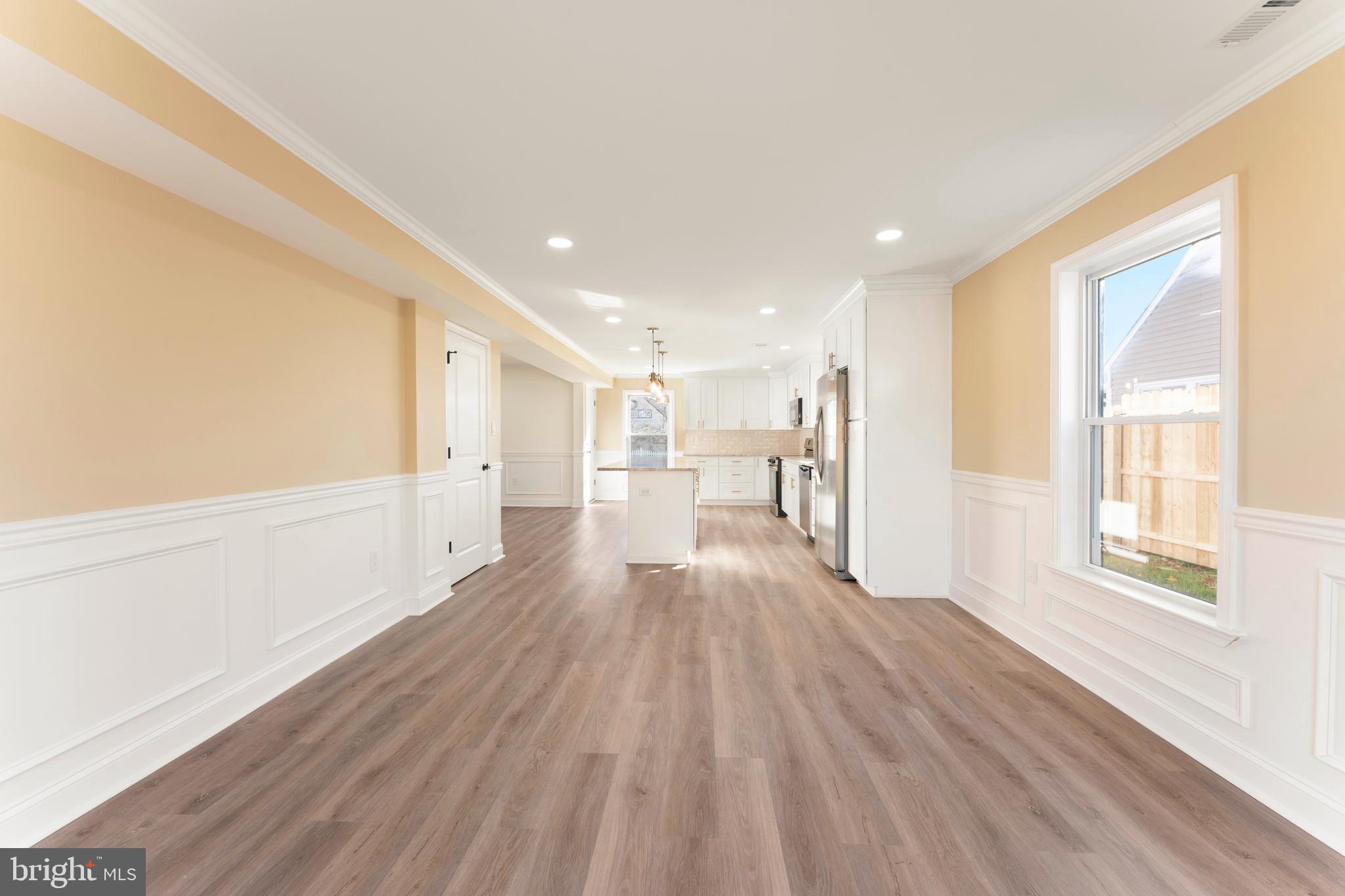 43 Petunia Road Levittown, PA 19056 - Photo 14 of 35 a view of a big room with wooden floor and windows