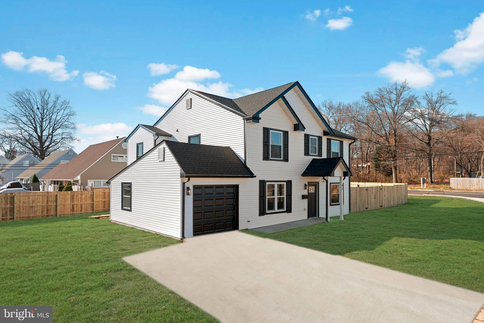 43 Petunia Road Levittown, PA 19056 - Photo 2 of 35 a front view of a house with a garden and yard