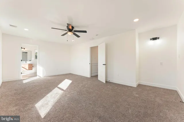 a view of a livingroom with a ceiling fan