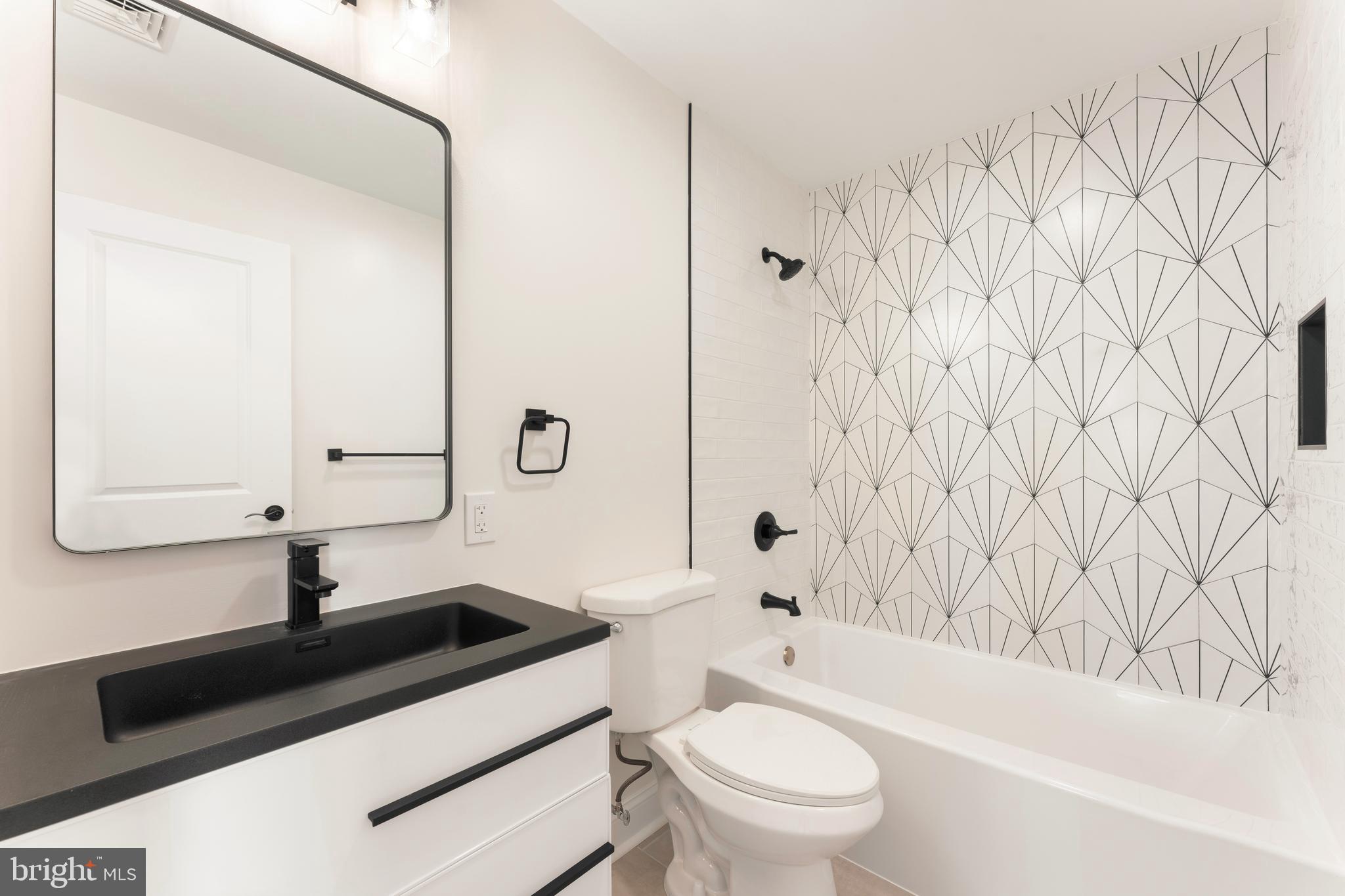 43 Petunia Road Levittown, PA 19056 - Photo 33 of 35 a bathroom with a sink a toilet and a bathtub