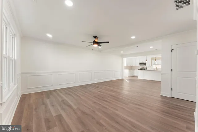 a view of a livingroom with wooden floor