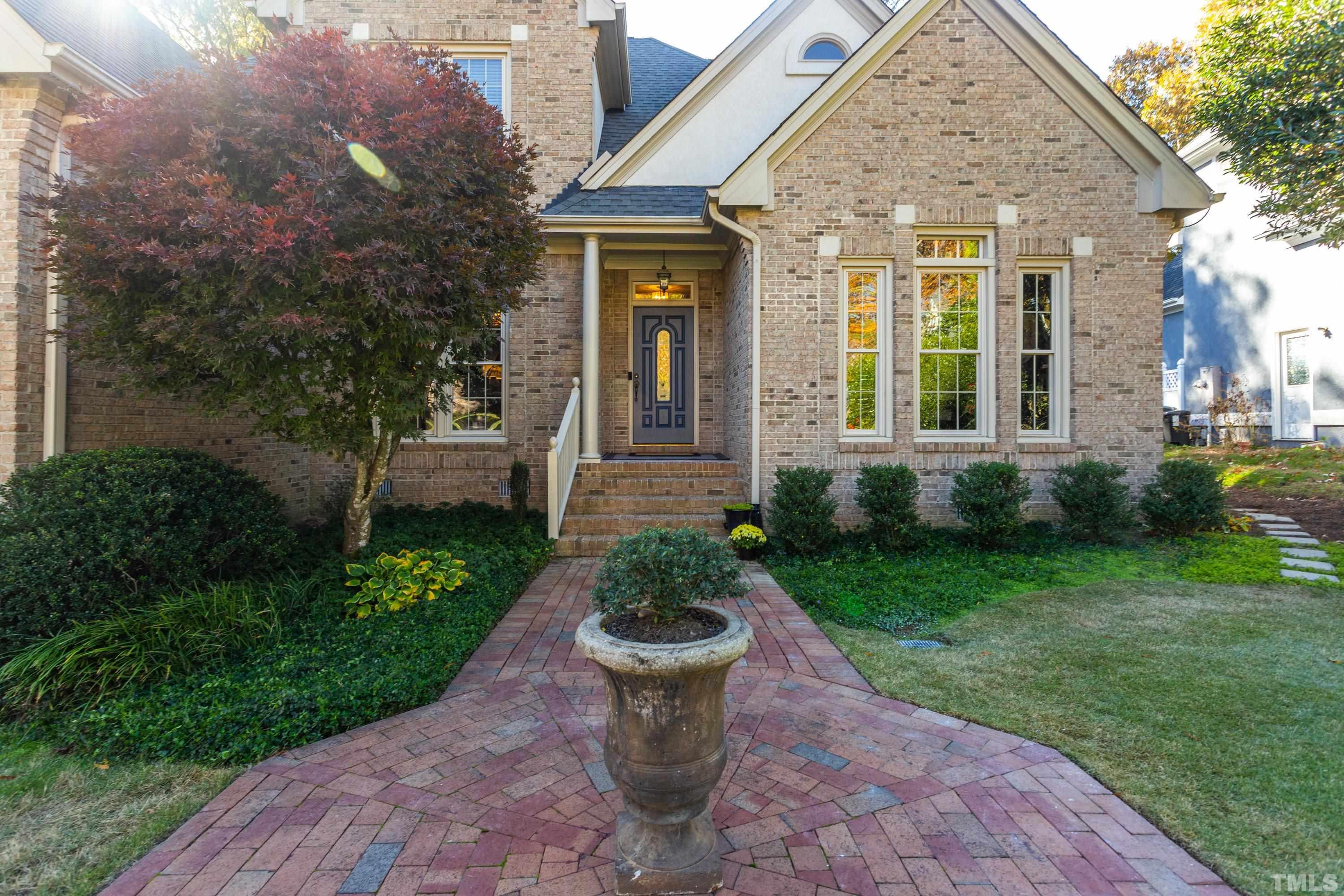 114 Old Pros Way Cary, NC 27513 - Photo 3 of 26 a front view of a house with a garden