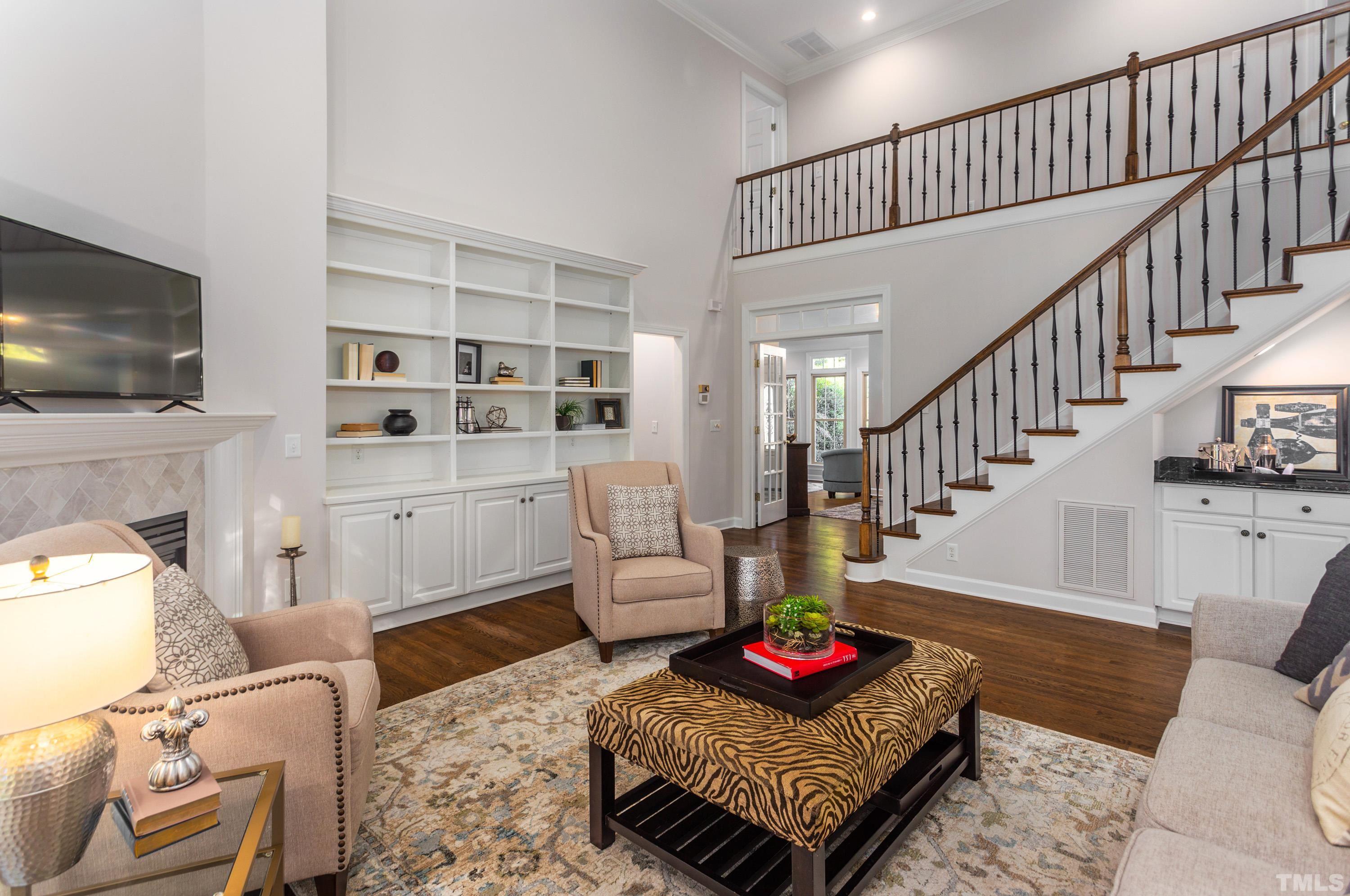 114 Old Pros Way Cary, NC 27513 - Photo 4 of 26 a living room with furniture and a flat screen tv
