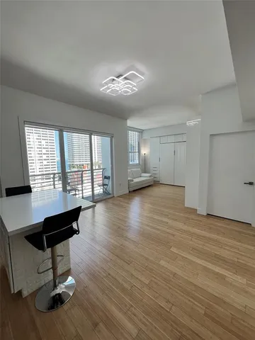 a view of an empty room with glass door