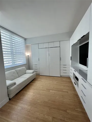 a living room with furniture and windows