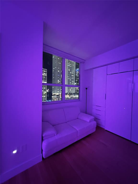 133 Northeast 2nd Avenue, Unit 1610 Miami, FL 33132 - Photo 14 of 52 a view of a room with wooden floor and windows