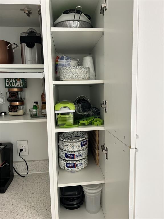 133 Northeast 2nd Avenue, Unit 1610 Miami, FL 33132 - Photo 31 of 52 a room with a wooden floor and shelf