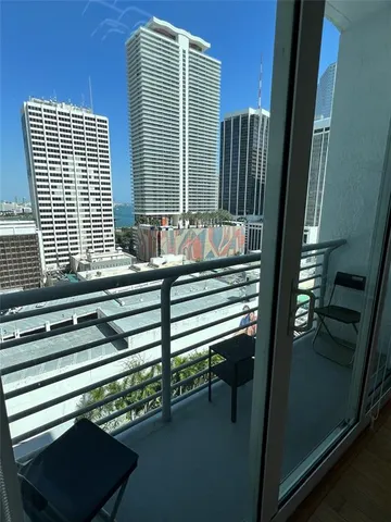a view of a balcony with chairs