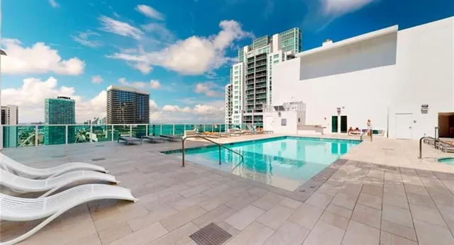 an aerial view of a house with a roof deck