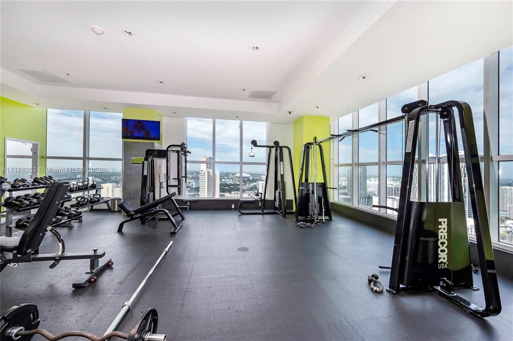 133 Northeast 2nd Avenue, Unit 1610 Miami, FL 33132 - Photo 44 of 52 a view of a room with gym equipment