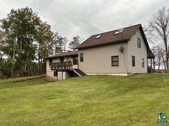 8353 Mannik Road Iron River, WI 54847 - Photo 18 of 52 Rear view of property featuring a yard, a deck, and stairway